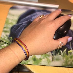 A colorful Pura Vida rope bracelet.